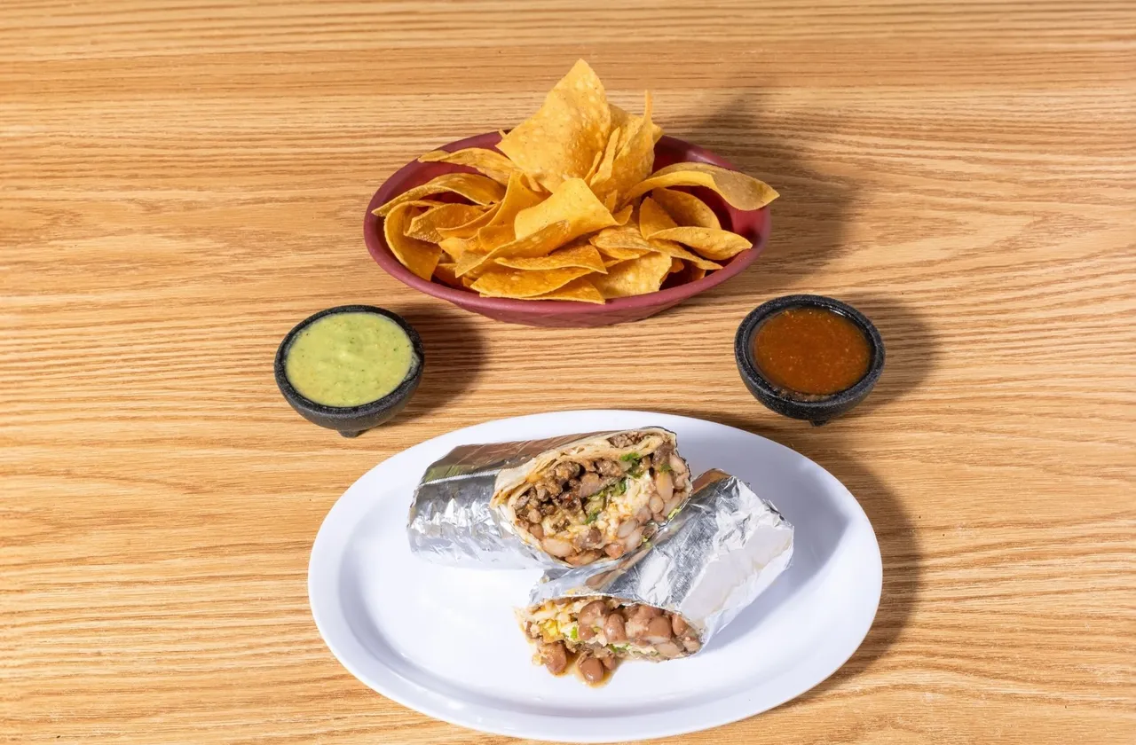 Ranchero burrito with red sauce and toppings