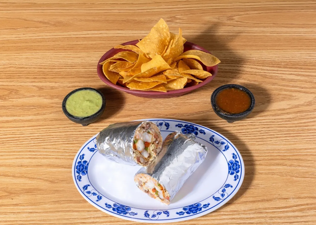 Shrimp burrito with rice, beans and salsa